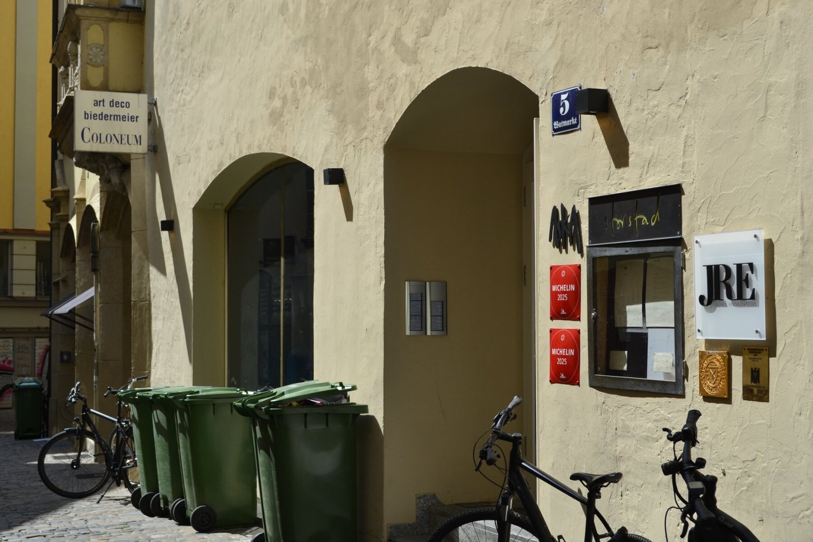 Sunlit historic façades and bicycles in Regensburg