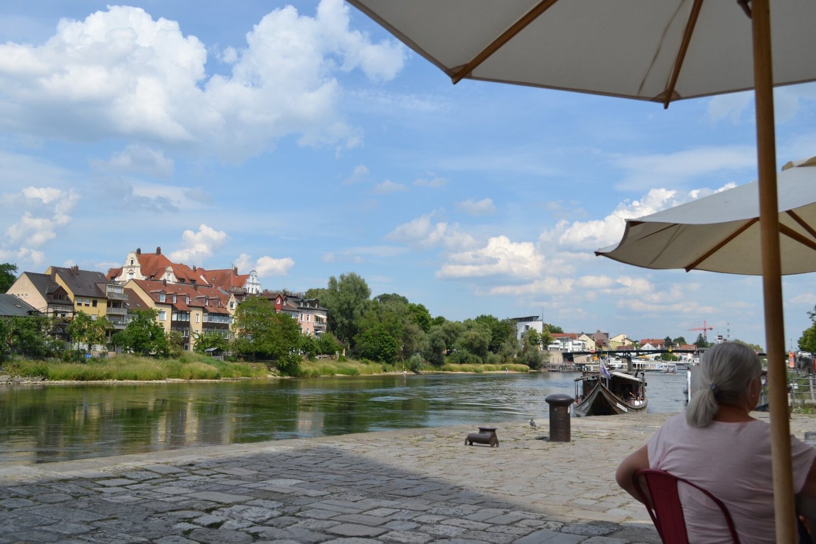 A quiet riverside café view in Regensburg